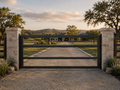 The Range driveway gate — clean horizontal rail steel gate with modern ranch aesthetic | GateBound
