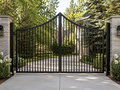 The Crest ornamental steel driveway gate — convex bow top profile rising to center peak | GateBound